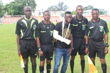 Micheal Babatunde, with match officials at a recent game in Lagos