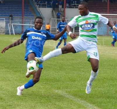 Victor Ezuruike tries to stop an Enyimba player in the League last season