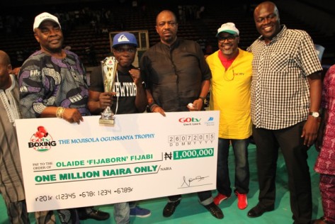 L-R: Adewunmi Ogunsanya, Chairman MultiChoice Nigeria; Olaide Fijabi, winner of a trophy and One Million Naira; Jenkins Alumona, Managing Director, Flykite Productions; John Ugbe, Managing Director, MultiChoice Nigeria and Felix Awogu, General Manager, SuperSport during 3rd GOtv Boxing Night held at the Indoor Sports Hall of National Stadium Surulere, Lagos Sunday 26th of July, 2015
